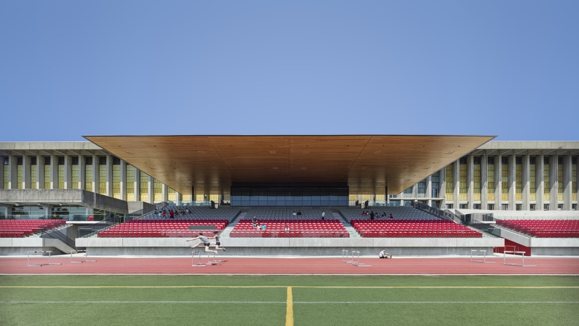The new grandstand at Simon Fraser University on a sunny day with clear blue skies.